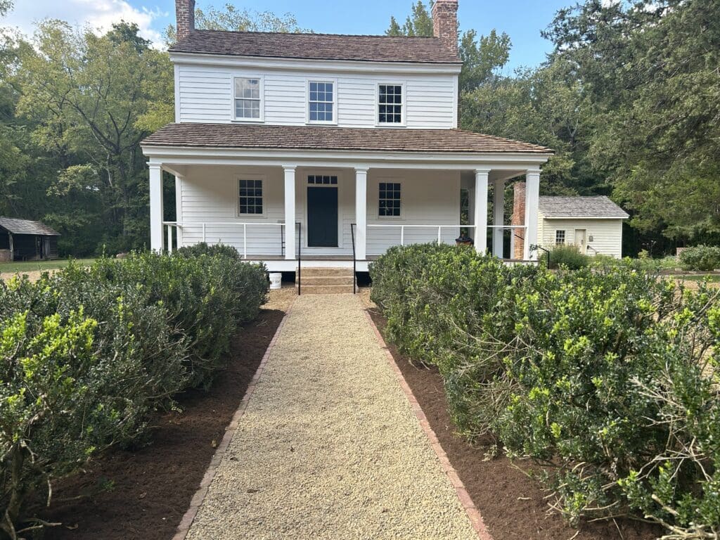 photo of a white, two story revolution era house